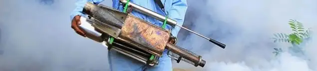 Fumigation technician using a fogger for deep pest treatment in Arvada, CO
